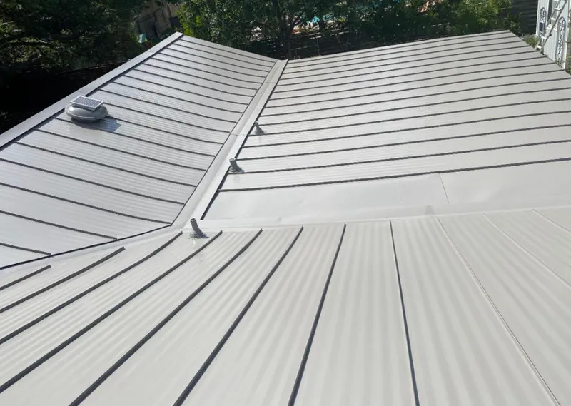 Solar attic fan installed on a metal roof for Roof Ventilation in Fond du Lac